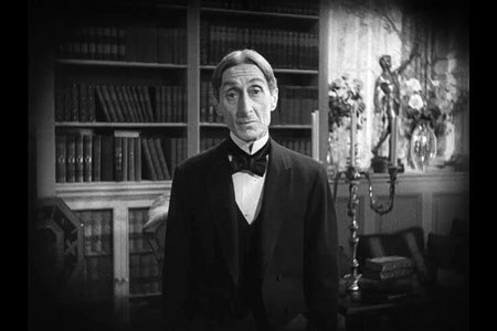 Man wearing bow-tie, directly facing camera.