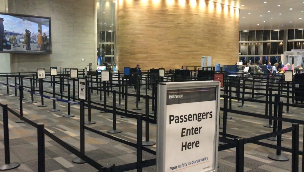 airport security area with warning signs
