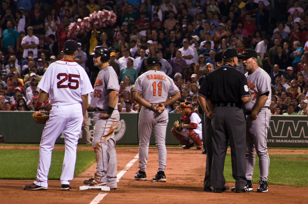 Baseball payers argue with one another as well as the ref.